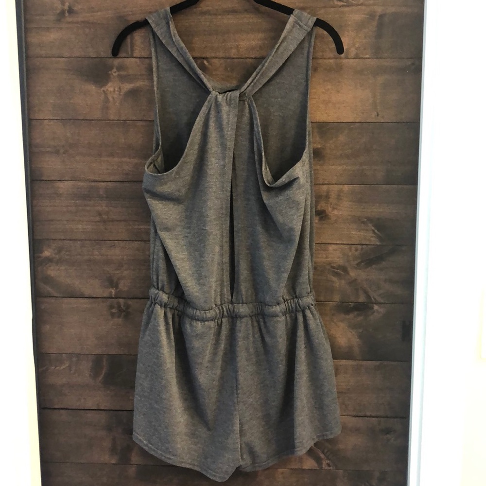 Grey open back romper with side pockets